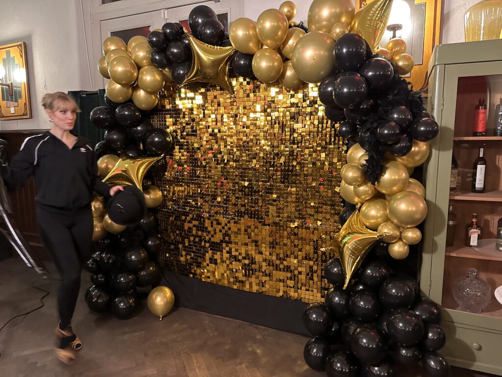 Black and gold photo wall for your event